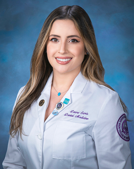 Boynton Beach dentist Doctor Suris smiling in white lab coat