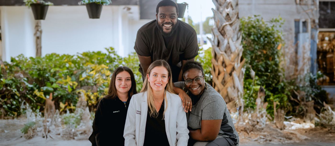 Two smiling dentists and team members at Family Dentistry of Boynton Beach