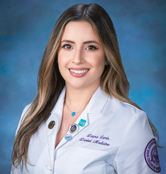 Boynton Beach dentist Doctor Laura Suris smiling in a white lab coat