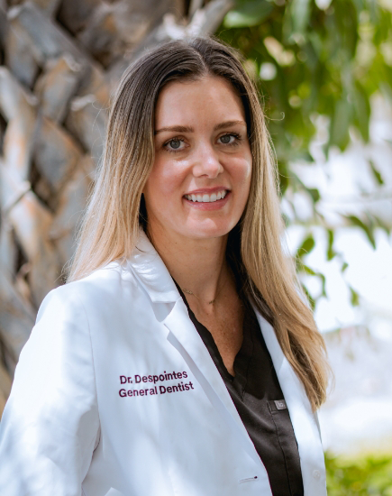 Boynton Beach dentist Doctor D smiling in white lab coat