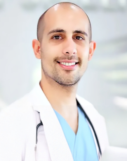 Boynton Beach dentist Doctor Rodriguez smiling in white lab coat