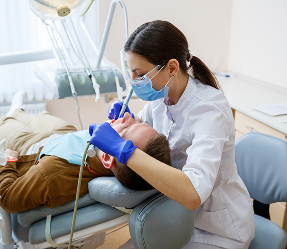 Dentist giving a patient a dental checkup