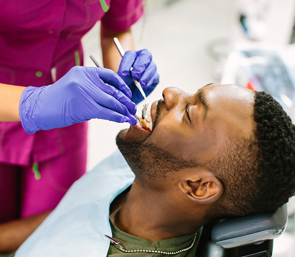 Man receiving a dental checkup