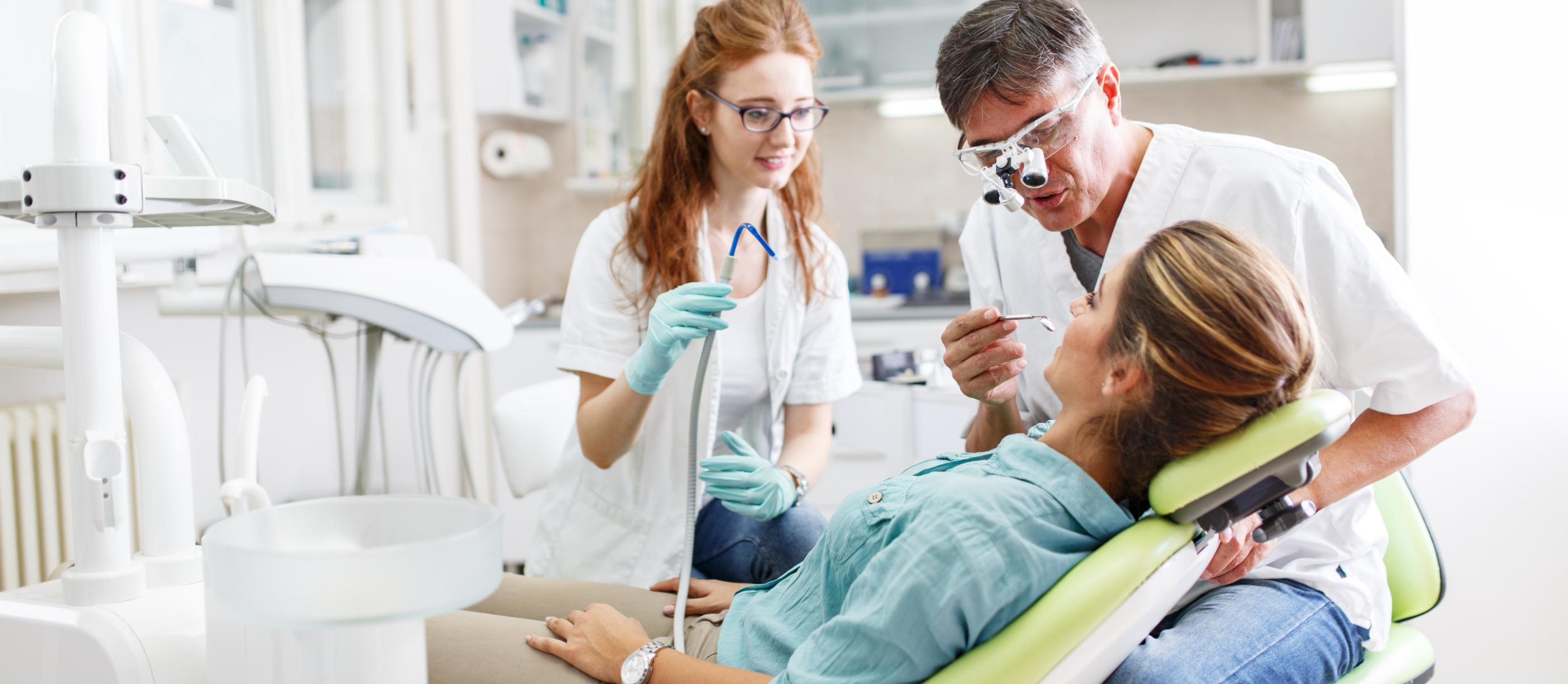 Dentist and assistant treating a patient with tooth colored fillings in Boynton Beach